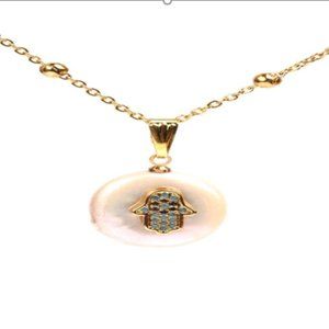Hamsa Necklace on a Shell